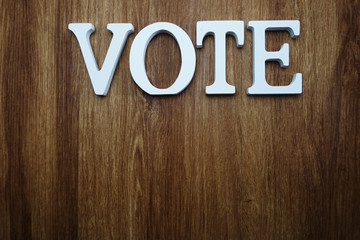 top view of wooden letters with word vote alphabet on wooden backgrou