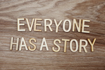 every on has a story text message on wooden background