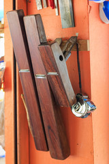 Carpenters are using tools with wood working furniture.