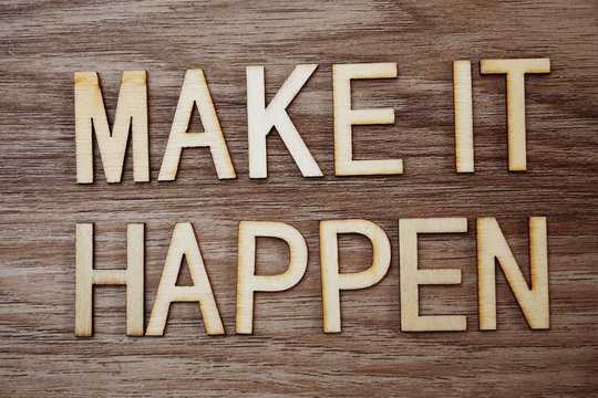 Make It Happen Text Message On Wooden Background