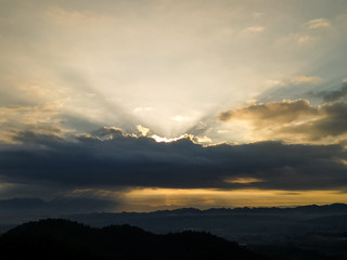 Morning sky with sunrise and dark shadows of nature