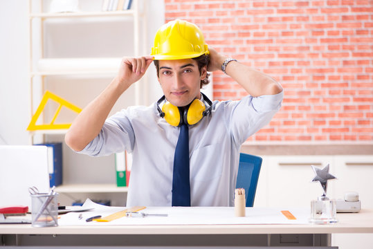 Construction supervisor working on blueprints