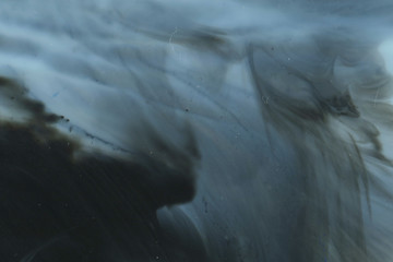 Abstract ink background. Marble style. Black paint stroke texture on white paper. Wallpaper for web and game design. Grunge mud art. Macro image of pen juice. Dark Smear.