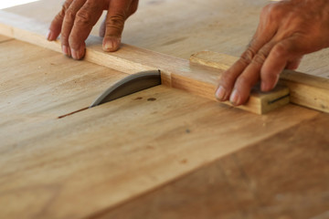 Carpenters are using tools with wood working furniture.