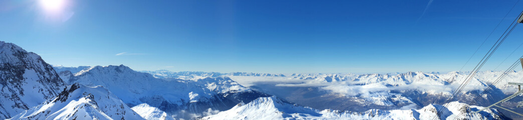 Fototapeta na wymiar beautiful panoramic view on alpine french peak mountain from ski slope in winter