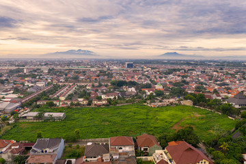 Crowded housing with beautiful Jakarta skyline at dusk