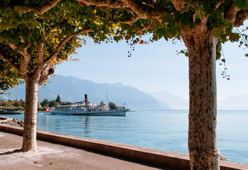  Montreux, Switzerland - Vintage sightseeing tour boats  in lake Geneva with Swiss alps view