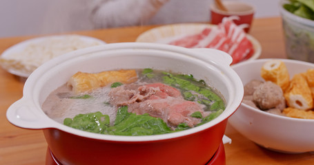 Family having hot pot at home