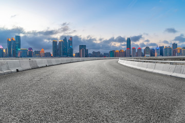 Empty asphalt road along modern commercial buildings in China,s cities