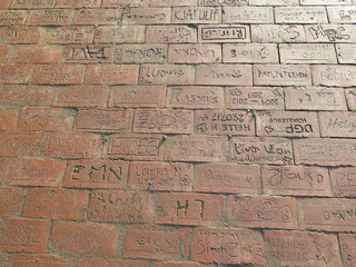 Fototapeta na wymiar Signed inscribed bricks in pavement at Scouts hut in Sothern Denmark