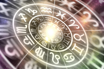Zodiac signs inside of horoscope circle on universe background