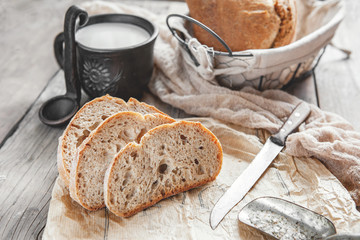 Delicious homemade sourdough rye bread on a plate and milk. Homemade baking