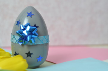 Easter composition with big eggs on color background, space for text