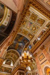 Obraz premium SAINT PETERSBURG, RUSSIA - January 2, 2019: Beautiful interior of the St Isaac's Cathedral. Luxurious ceiling and dome inside the famous cathedral.