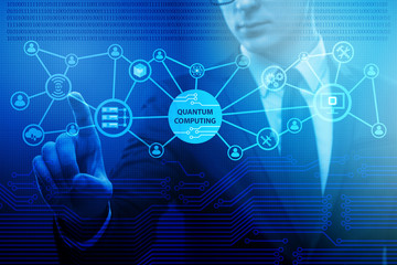 Businessman pressing virtual button in quantum computing concept