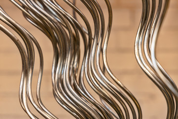 building material - curved rods in silver metal