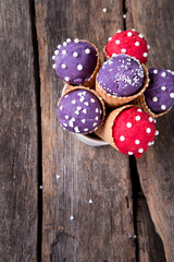 Ice cream scoops in sweet cone on wooden table. 