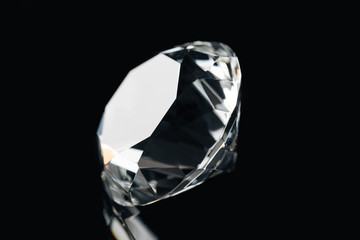 pure shiny diamond isolated on black
