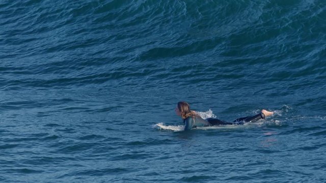 Surfer Catches A Wave In Beautiful Light (Slow Motion)