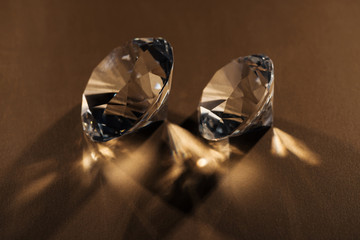 sparkling clear diamonds on brown background