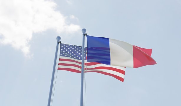 USA and France, two flags waving against blue sky. 3d image