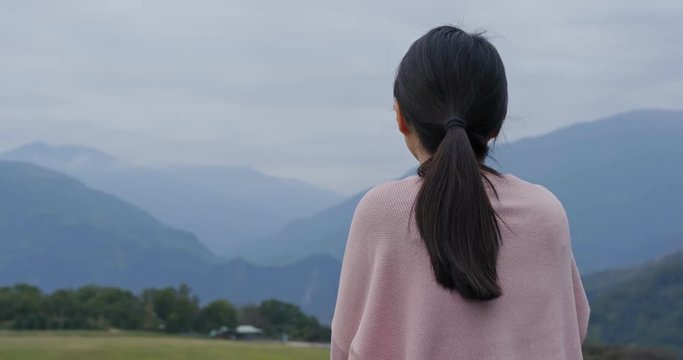 Woman enjoy the view in countryside