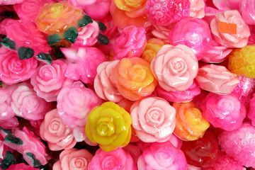 Soap in the shape of a rose with the traditional Bulgarian rose oil. Bulgarian rose oil background texture. spa and aromatherapy. Product of rose oil. Natural soap. 