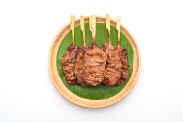 grilled skewered milk pork with white sticky rice