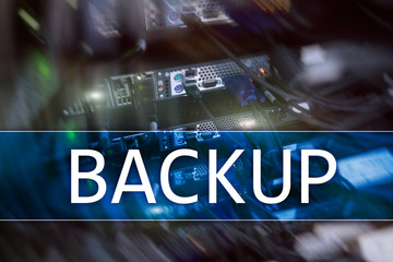 Backup button on modern server room background. Data loss prevention. System recovery.