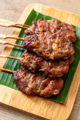 grilled skewered milk pork with white sticky rice