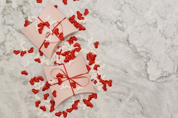 Beautiful valentines day paper hearts on marble background. romantic background greeting card, box, strips and hearts.