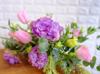Beautiful flower bouquet in full blossom with white wall background
