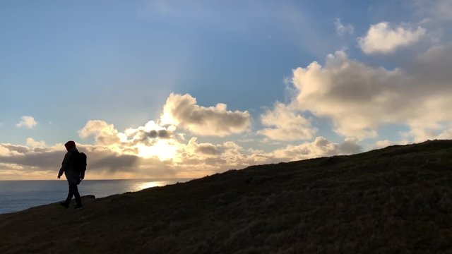 man on top of mountain on the Faroe Islands