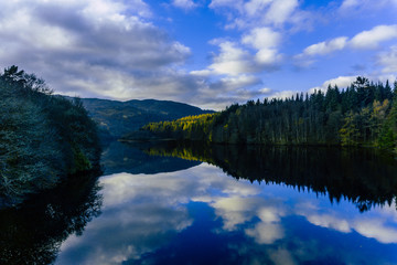 Fototapeta na wymiar A mirror lake in Scotland