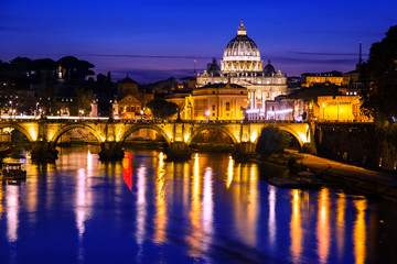 Obraz na płótnie Canvas Night view of St. Peter's Basilica in Vatican city with the bridge over the Tiber river, Rome, Italy