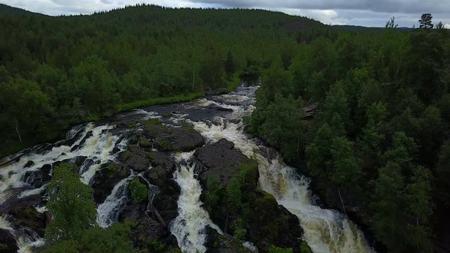 Aerial flight under the Shuoniyoki waterfall at Kola semi island