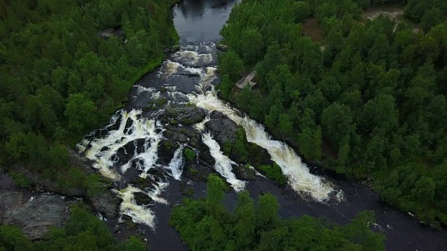 Long shot of unesco waterfall treshold deep in the Russian forests