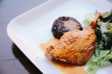 duck confit with rice and salad , italian food style