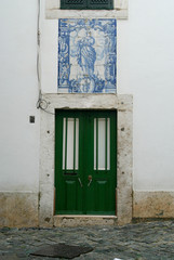 Old wooden door on facade wall
