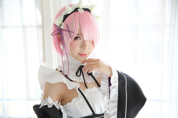 Portrait of Japan anime cosplay woman , white japanese maid in white tone room