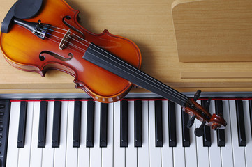 Keyboard piano and violin. Close-up © yrafoto