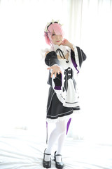 Portrait of Japan anime cosplay woman , white japanese maid in white tone room