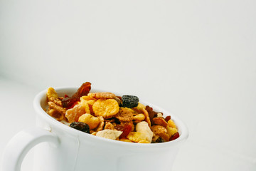 Muesli in a white cup