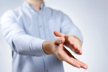 Man clapping hands on neutral background