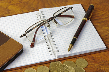 Fountain pen, flashcard, notebook and glasses