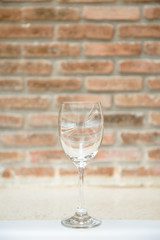 Empty Wine glasses with brick wall background