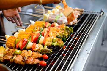 Grilled pork with BBQ sauce on sticks, thailand street food