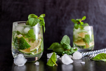 Mojito Cubano or caipirinha cocktail, iced drink with lime and mint