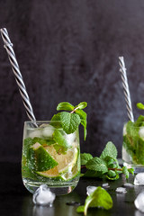 Mojito Cubano or caipirinha cocktail, iced drink with lime and mint