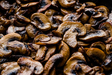 Cooked and Sliced Cultivated Mushrooms Close Up Macro View in Pan.